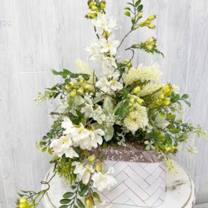 Year Round Cream and Green Arrangement on a Storage Box